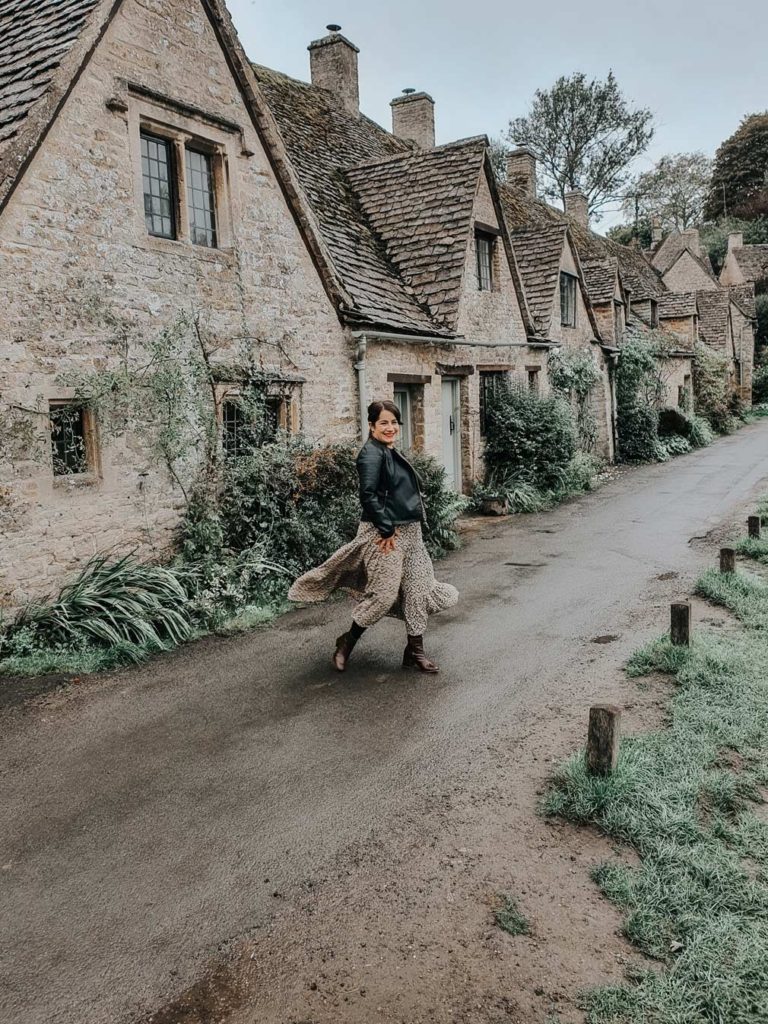 Lauren walking along Arlington Row on a rainy day.