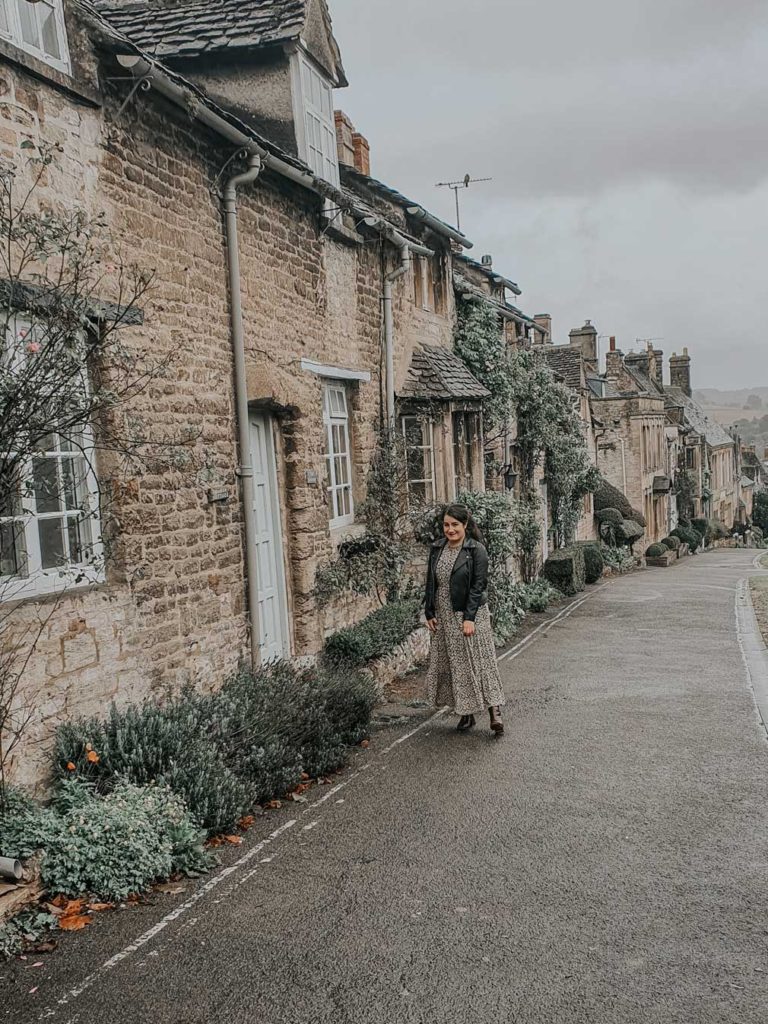 Lauren walking along Burford Hill on a rainy day.