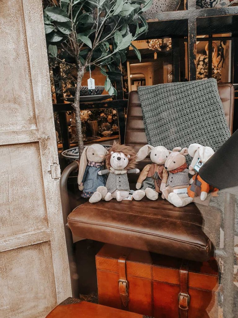 Cute animal teddies in the window display of Three French Hens.