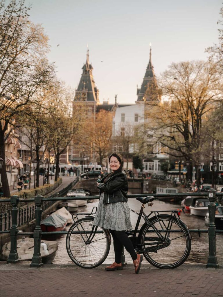 brunette-woman-in-amsterdam-with-views-of-the-rijksmuseum-in-the-distance
