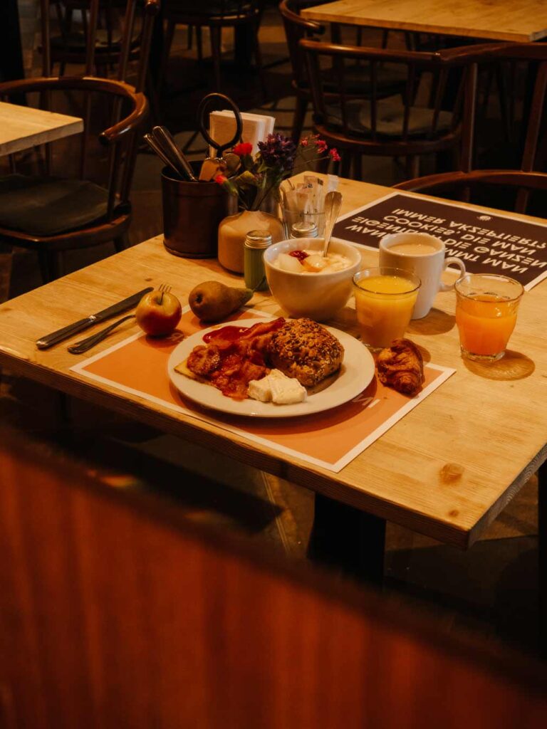Breakfast at Pierdrei Hotel Hafencity in Hamburg. Lauren opted for yoghurt and fruit, crossiants, bread, cheese, bacon, beans, tea and fresh fruit juices.