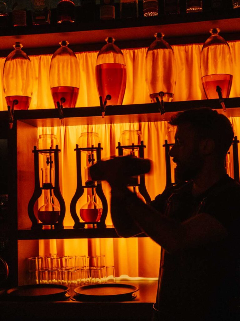 A man mixing cocktails at Drip Bar.