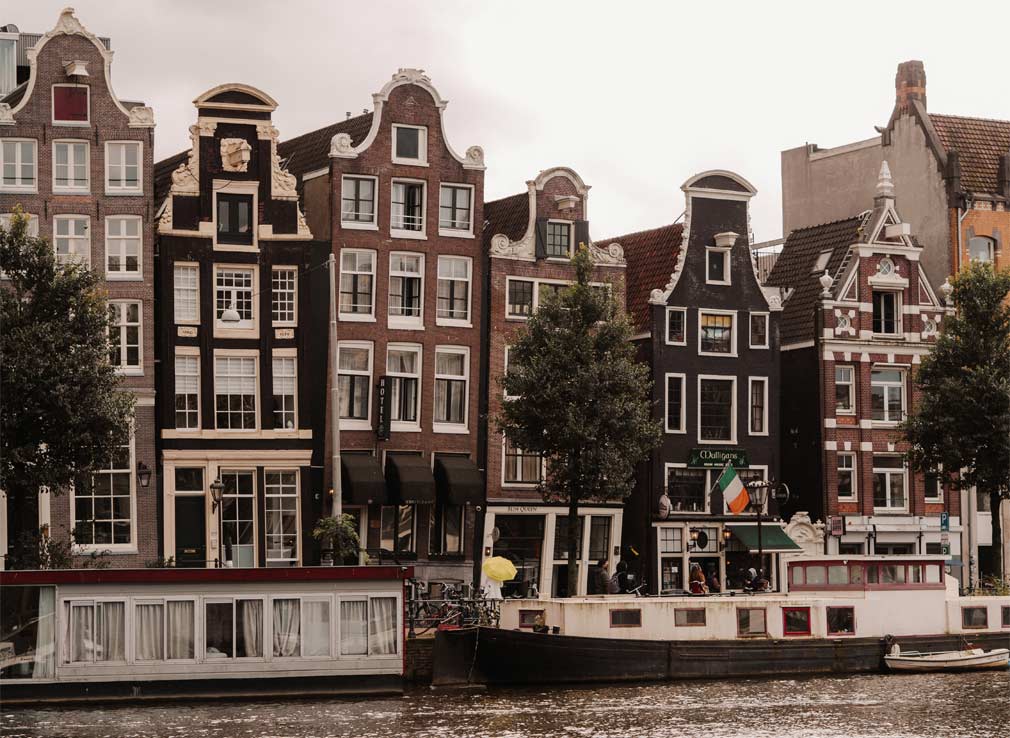 Views of the Dancing Houses in Amsterdam which are known for their crooked exteriors.