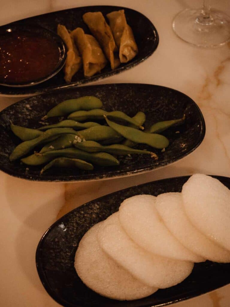 Prawn crackers, dumplings and edamame at Fiki Japanese Fusion Restaurant.
