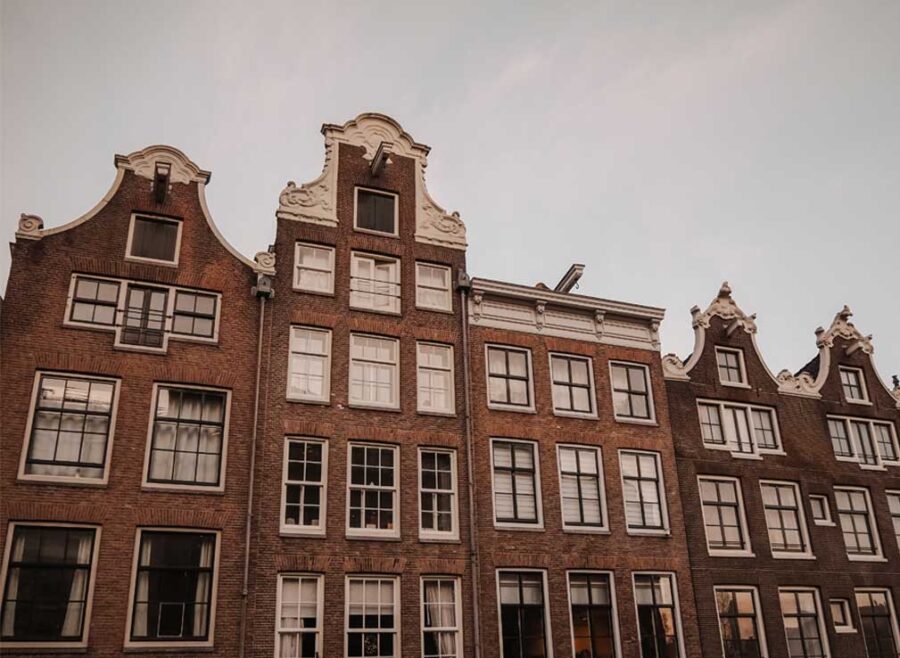 Authentic buildings in the Dutch capital during sunrise.